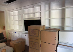 Built-in shelves cleared and boxes prepped for moving day