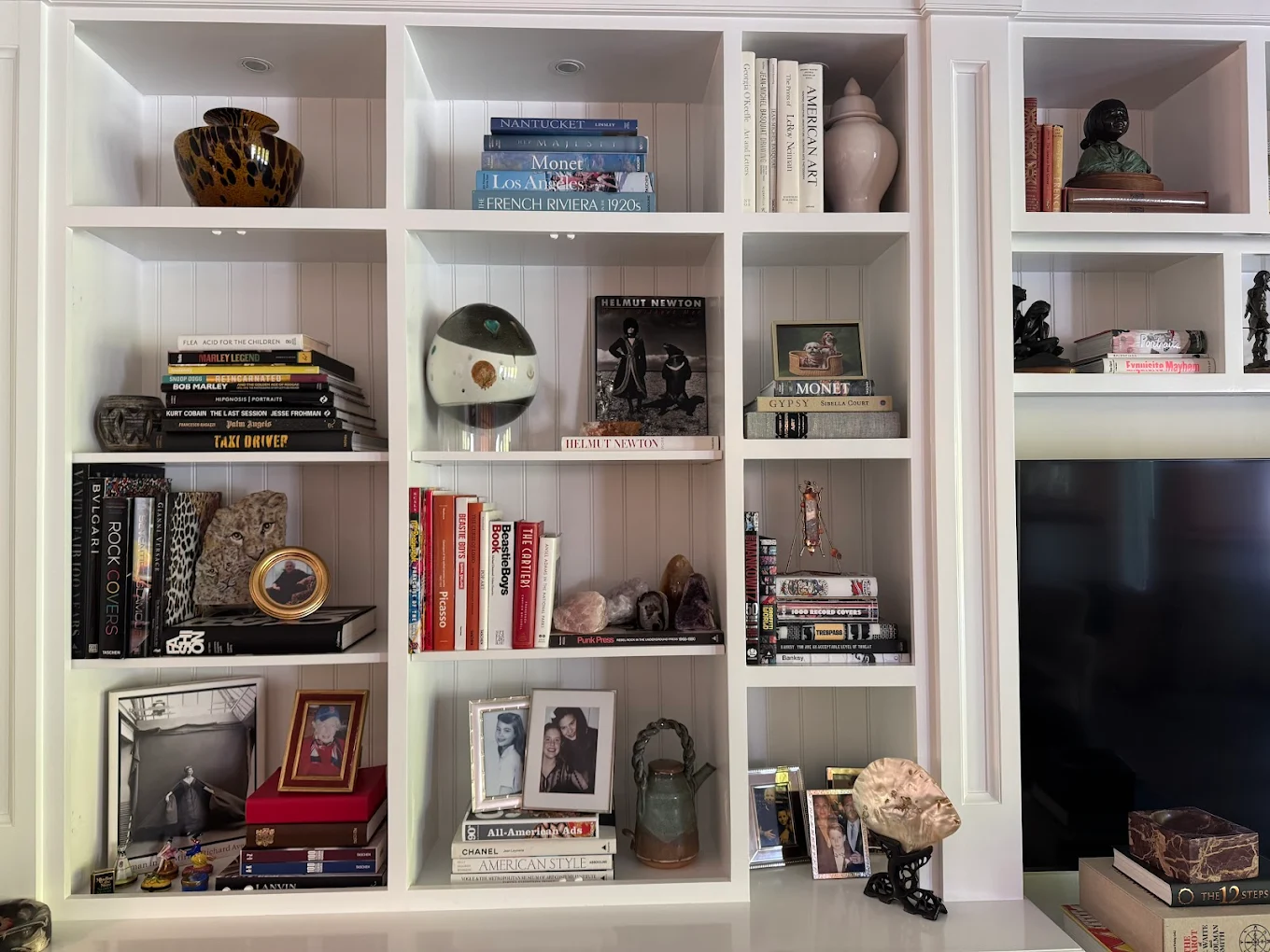 The same shelves fully styled with books and objects